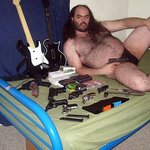 fat_hairy_guy_on_bed_with_guns-thumb-860x860-36692.jpg