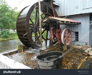stock-photo-water-wheel-at-saunooke-mill-a-working-stone-ground-mill-beside-the-oconaluftee-ri...jpg