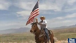 Cliven-Bundy-riding-horse-with-flag.jpg