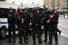 0578-2903380-French_police_wearing_body_armour_and_carrying_rifles_stand_guar-a-48_1420812813818.jpg