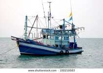 stock-photo-small-fishing-boats-near-the-island-of-koh-chang-thailand-100219583.jpg