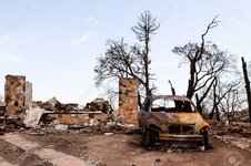 26272152-The-charred-remains-of-a-house-and-car-after-a-devastating-forest-fire-Stock-Photo.jpg