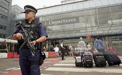 an-armed-british-police-officer-patrols-outside-of-heathrow-airport-picture-id71630242.jpg