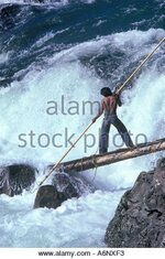 aboriginal-spearing-salmon-in-the-bulkey-river-in-british-columbia-a6nxf3.jpg