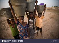 children-carrying-water-buckets-on-their-heads-AEEG8R.jpg