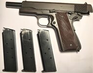 1943 Ithaca 1911A1 - Left side Action Open with 3 magazines.JPG