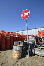 stop-sign-amidst-orange-highway-barrel-lone-rises-above-warning-construction-barrels-bases-923...jpg