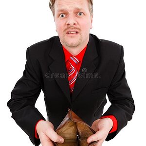man-showing-empty-wallet-17362963-3907874322.jpg