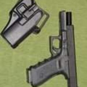 th_Glock22in40SWwithBlackhawkSerpaHols.jpg